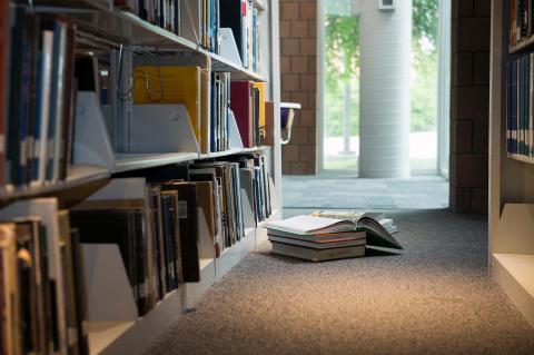 Open library books sit on the floor of the MSU Architecture Library